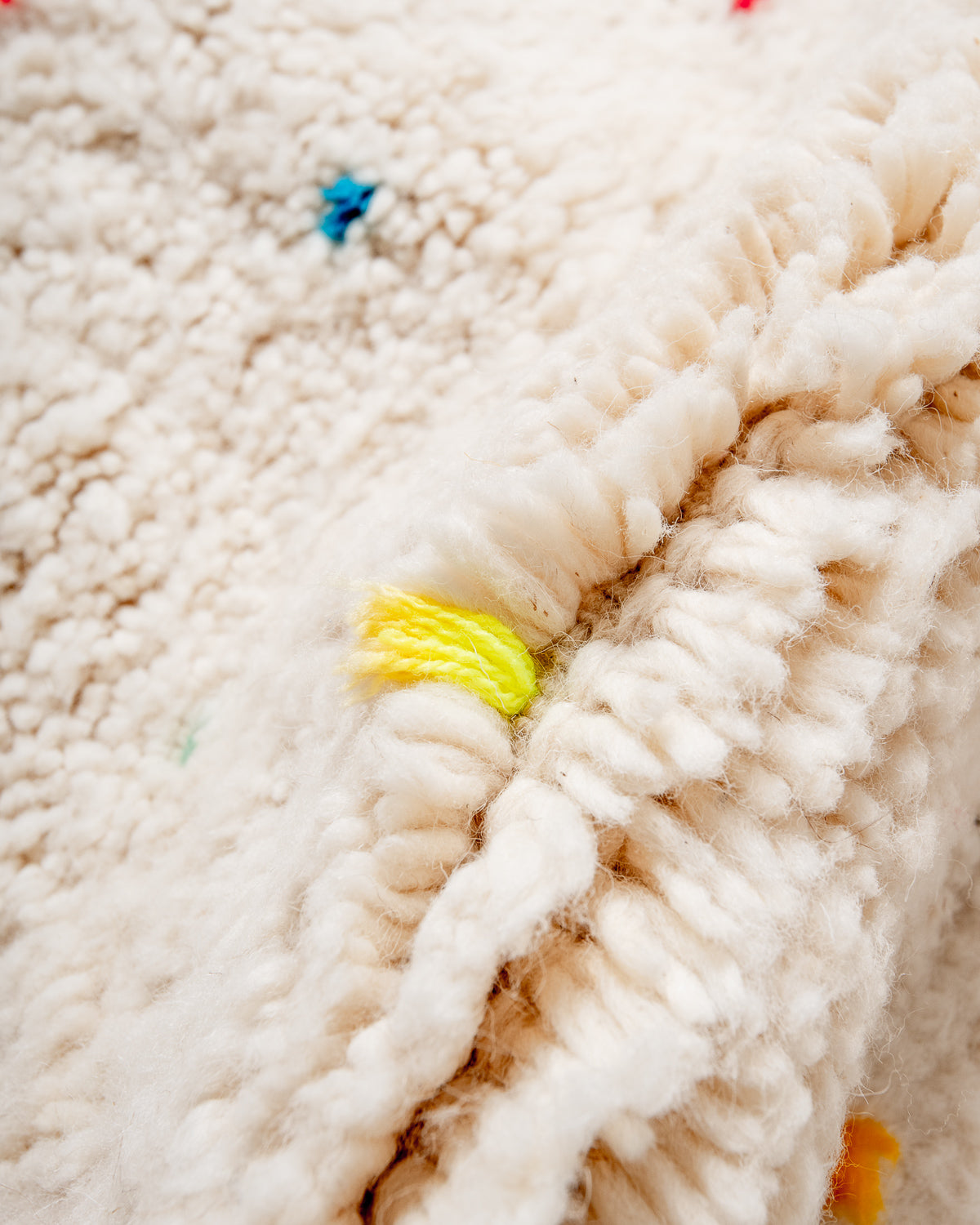 Modern, designer, handcrafted Berber rug from Morocco. Beniourain carpet with beautiful colours and patterns and fluffy wool texture.